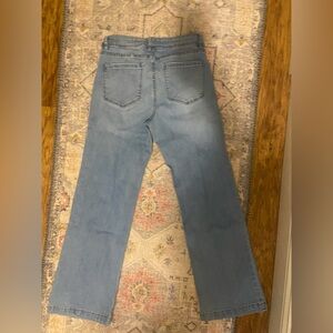 Wide leg pants with slight flair. Light wash.